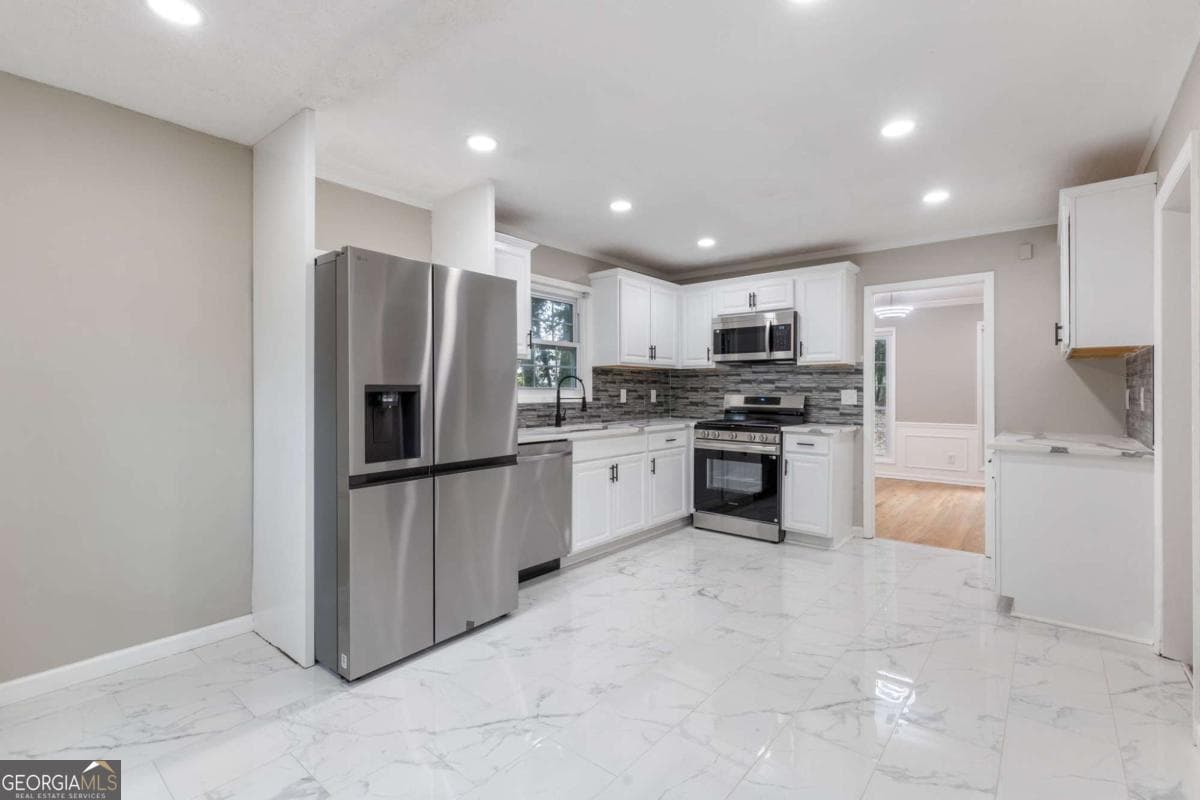 4 bedroom, 2.5 bathroom, 3,108 sq ft single family residence for sale at 1001 Gunners Walk, Tucker, GA 30084 — photo 9