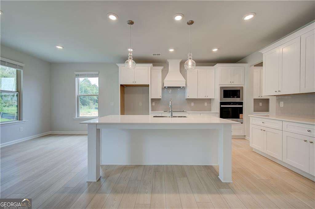 5 bedroom, 4.5 bathroom, 3,699 sq ft single family residence for sale at 709 Dunlake Way, Locust Grove, GA 30248 — photo 6