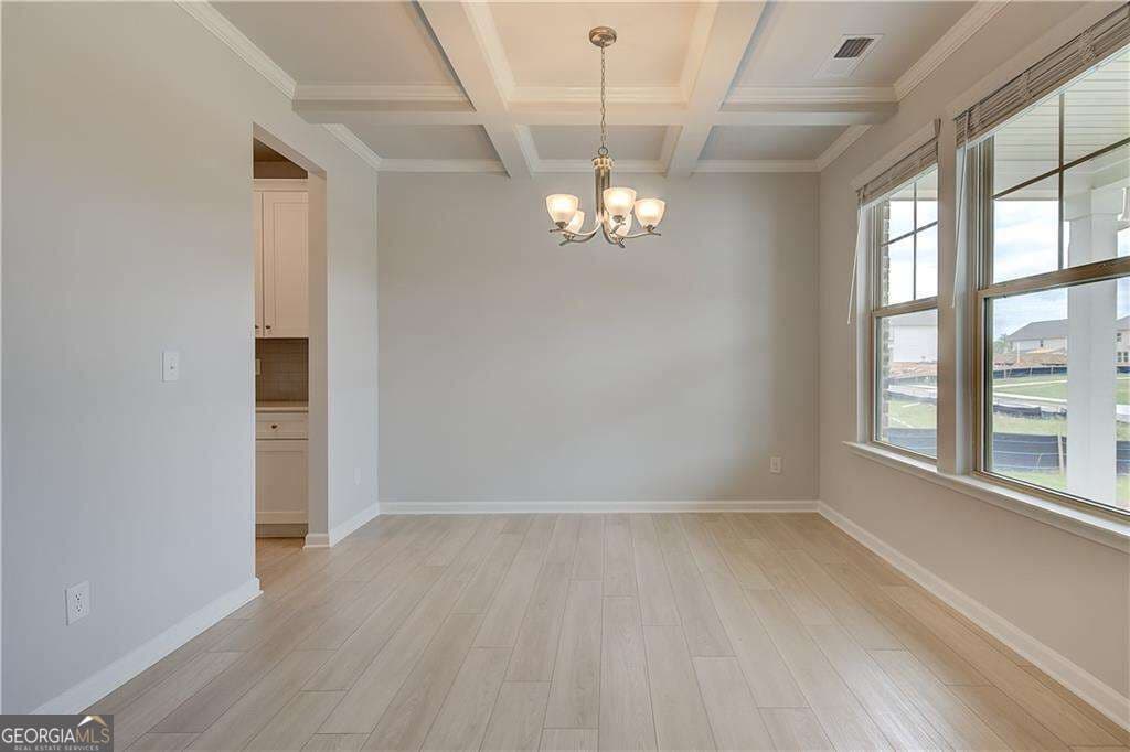 5 bedroom, 4.5 bathroom, 3,699 sq ft single family residence for sale at 709 Dunlake Way, Locust Grove, GA 30248 — photo 3
