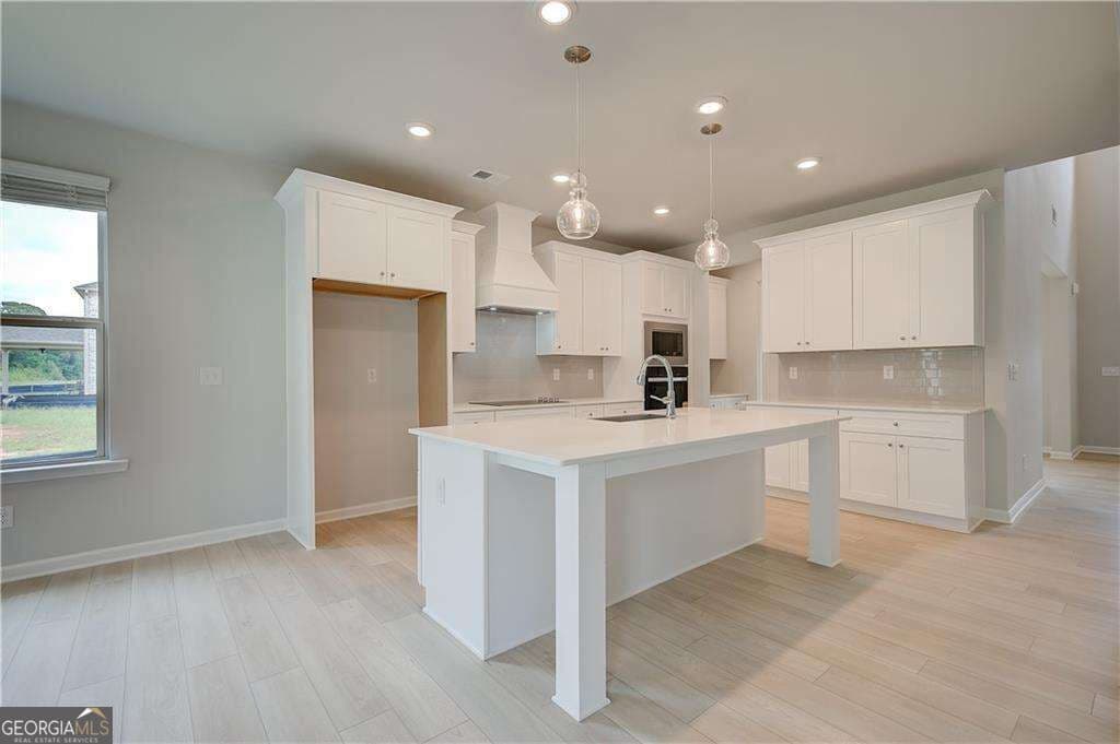 5 bedroom, 4.5 bathroom, 3,699 sq ft single family residence for sale at 709 Dunlake Way, Locust Grove, GA 30248 — photo 9