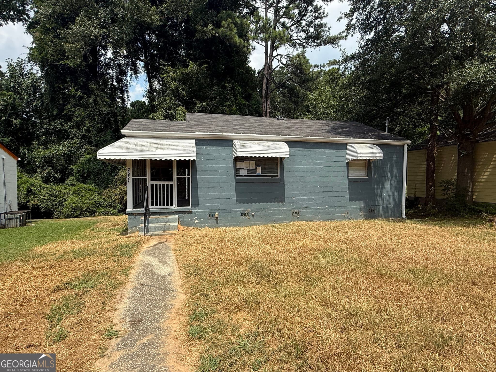 3 bedroom, 2 bathroom, 976 sq ft single family residence for sale at 2557 Loghaven Drive, Atlanta, GA 30318 — photo 1 of 25
