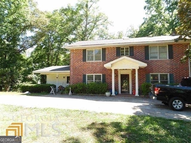4 bedroom, 2 bathroom, 3,504 sq ft single family residence for sale at 573 Lester Road, Fayetteville, GA 30215 — photo 1 of 11