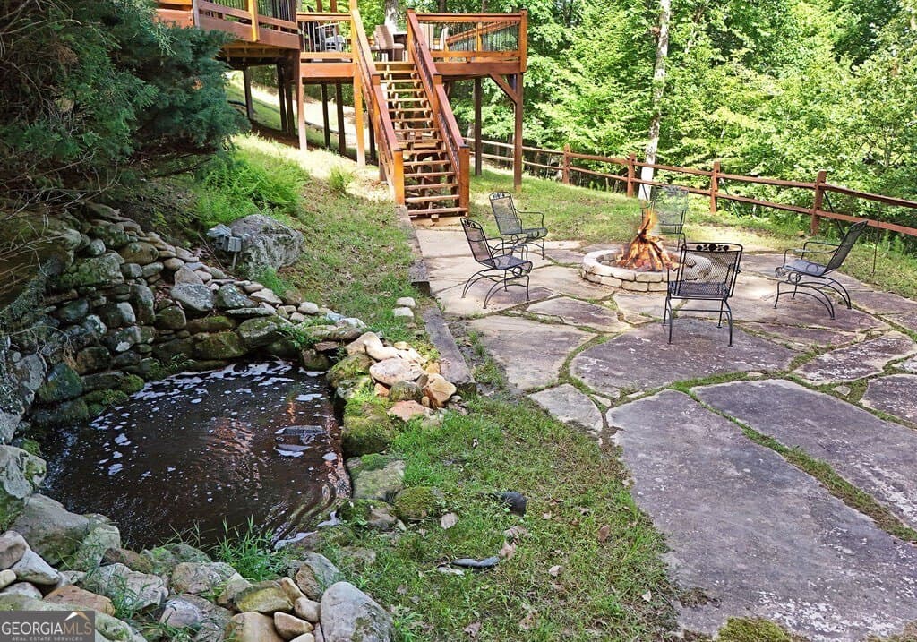 5 bedroom, 3.5 bathroom, 3,140 sq ft cabin,single family residence for sale at 71 High Country Lane, Morganton, GA 30560 — photo 8