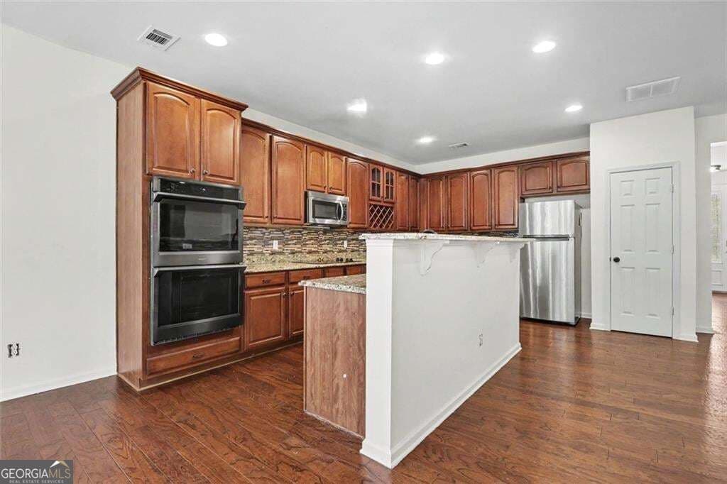 6 bedroom, 3.5 bathroom, 3,551 sq ft single family residence for sale at 6195 Park Leaf Walk, Buford, GA 30518 — photo 9