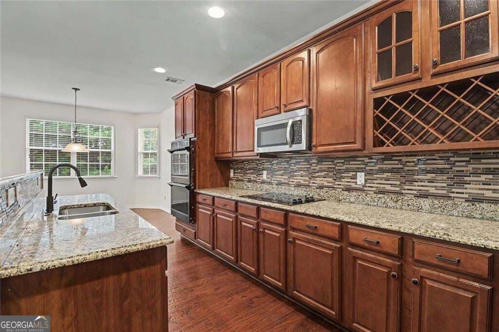 6 bedroom, 3.5 bathroom, 3,551 sq ft single family residence for sale at 6195 Park Leaf Walk, Buford, GA 30518 — photo 10