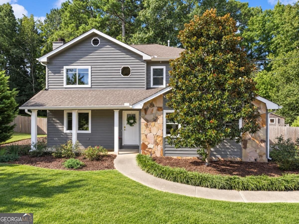 4 bedroom, 3.5 bathroom, 2,580 sq ft single family residence for sale at 1229 Gate Post Lane, Lawrenceville, GA 30044 — photo 1 of 65