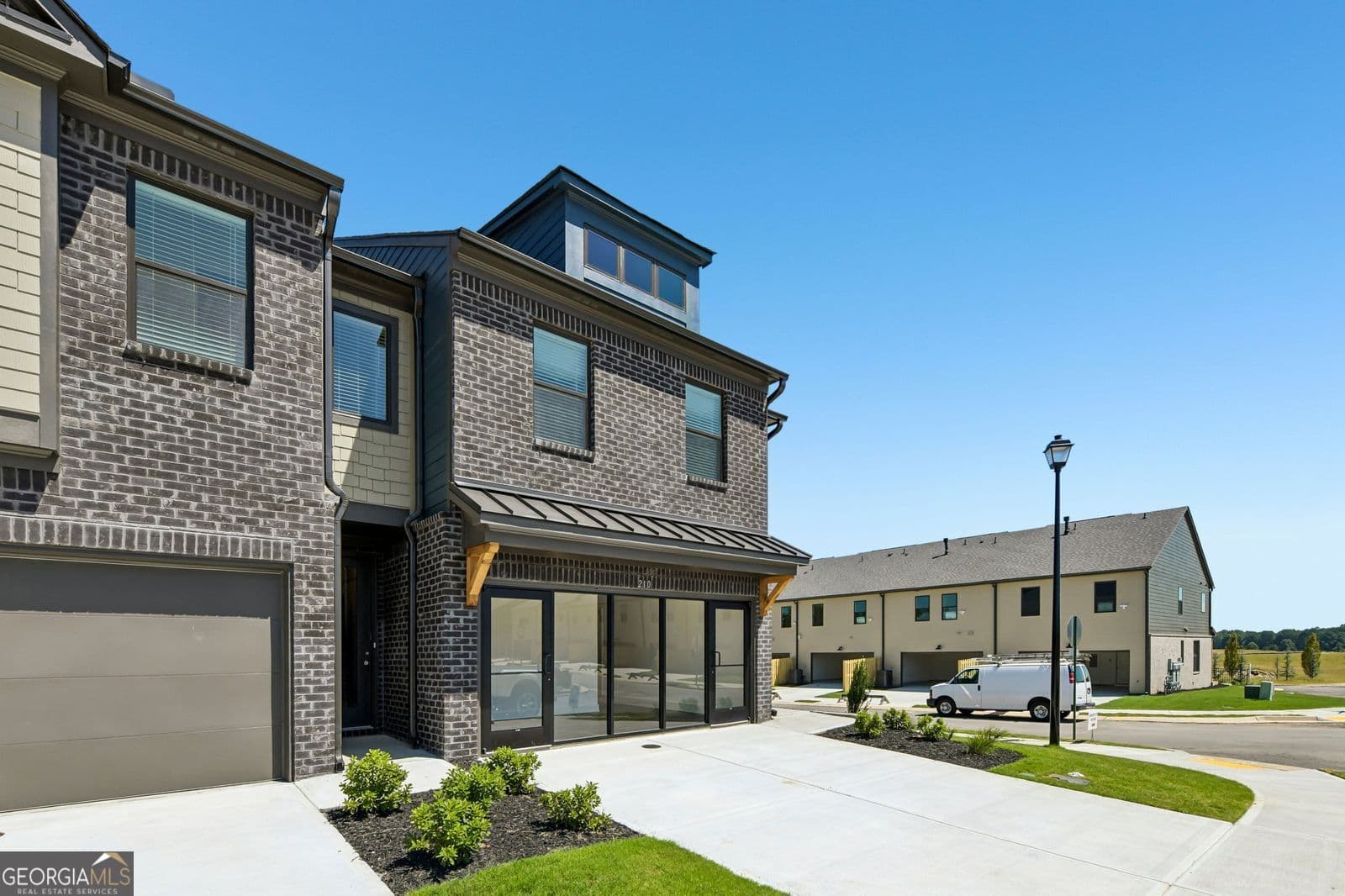 3 bedroom, 2.5 bathroom, 1,745 sq ft townhouse for sale at 218 Foxtrot Avenue 749, Hoschton, GA 30548 — photo 1 of 33