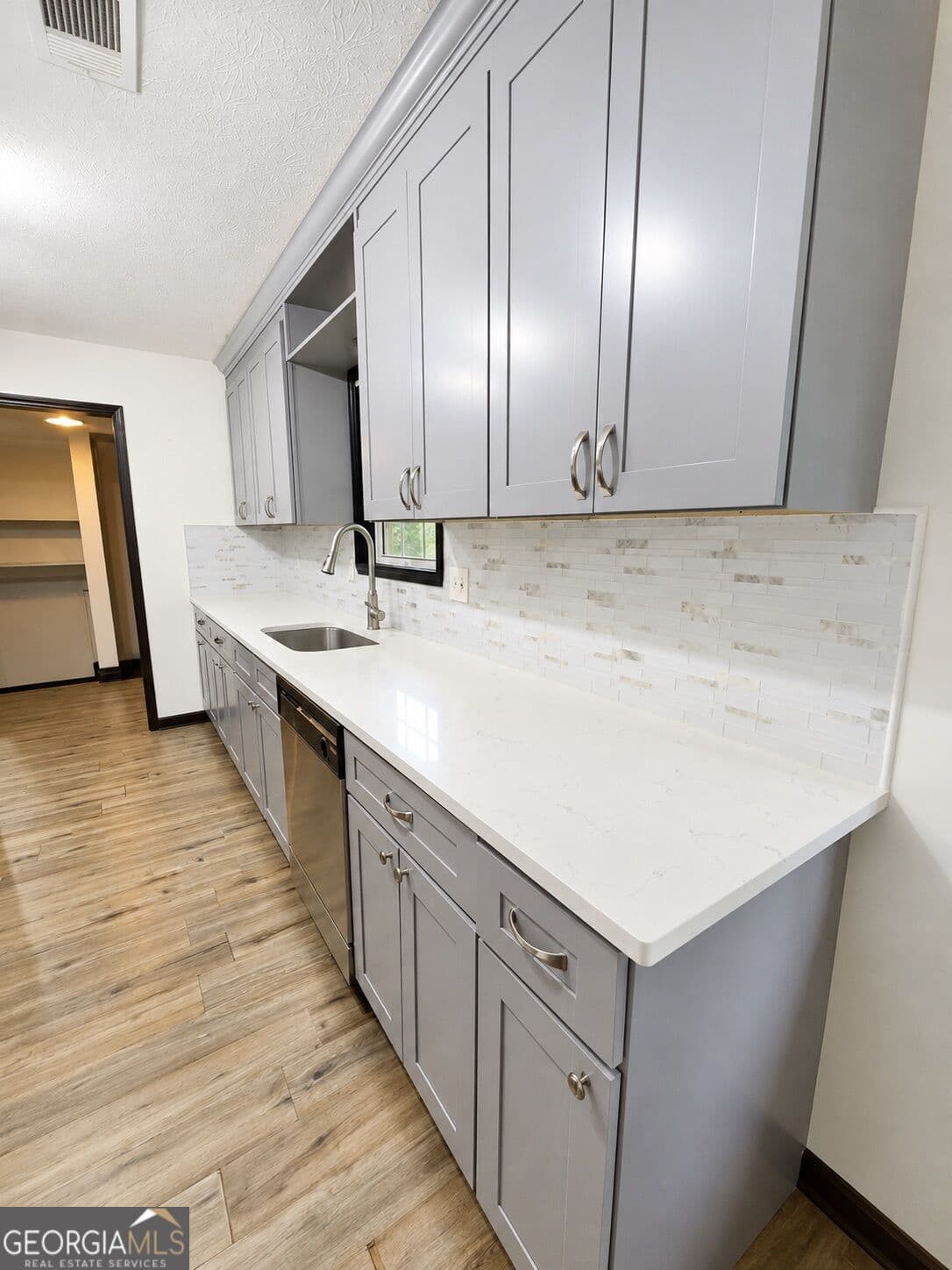 4 bedroom, 3 bathroom, 1,213 sq ft single family residence for sale at 1758 Eric Circle, Lawrenceville, GA 30043 — photo 5