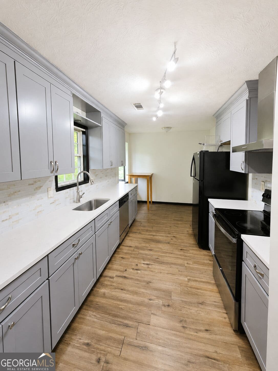 4 bedroom, 3 bathroom, 1,213 sq ft single family residence for sale at 1758 Eric Circle, Lawrenceville, GA 30043 — photo 4
