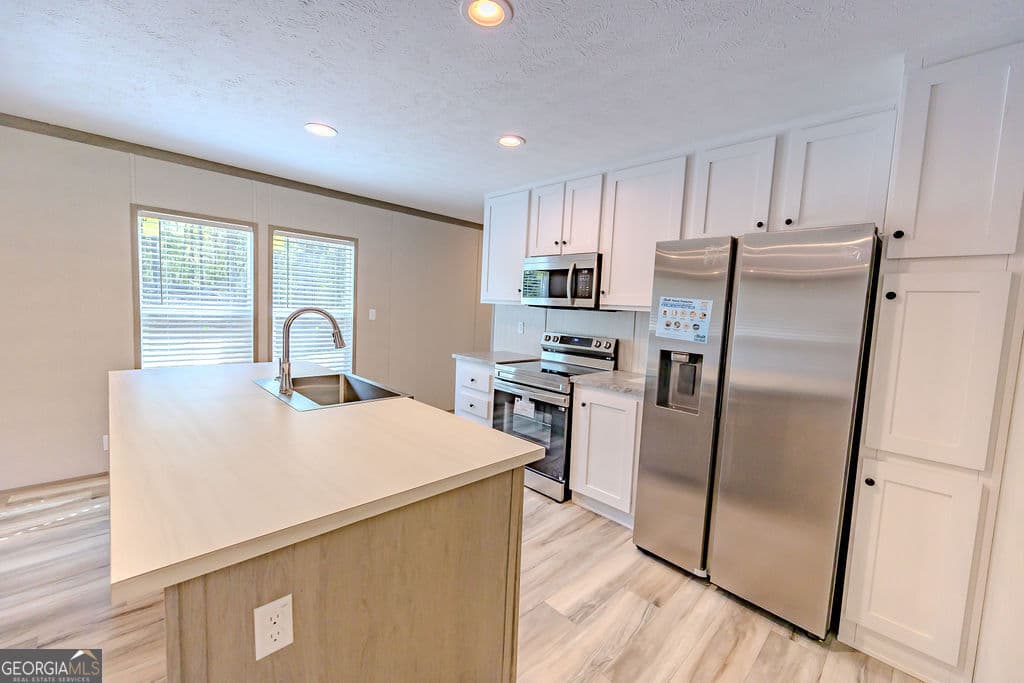 3 bedroom, 2 bathroom, 1,280 sq ft manufactured home,single family residence under contract at 944 Collins Lane, Rentz, GA 31075 — photo 7