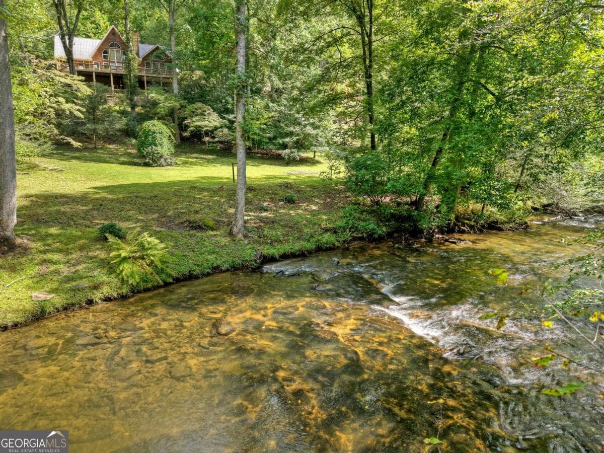 5 bedroom, 3 bathroom, 3,996 sq ft cabin,single family residence for sale at 324 Cooper Creek Drive, Suches, GA 30572 — photo 2