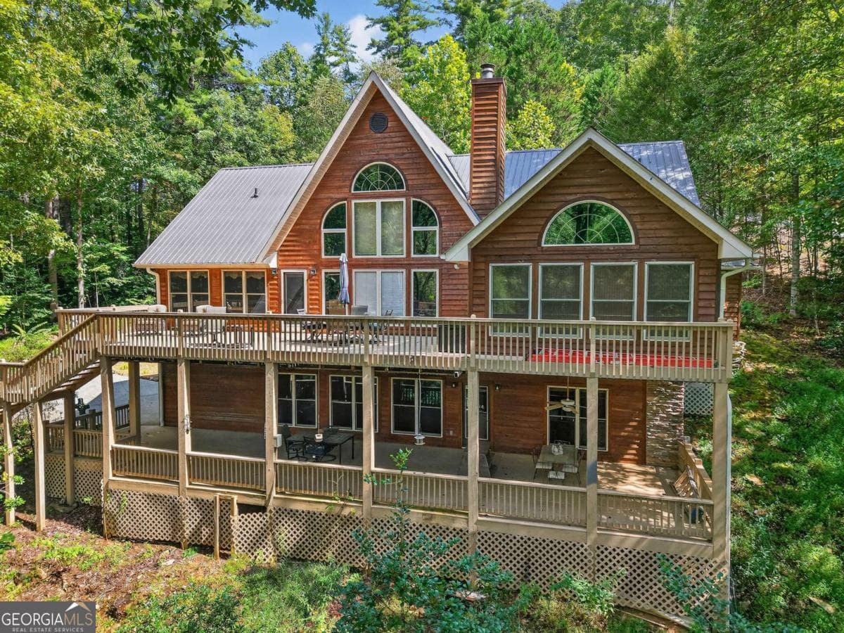 5 bedroom, 3 bathroom, 3,996 sq ft cabin,single family residence for sale at 324 Cooper Creek Drive, Suches, GA 30572 — photo 1 of 49