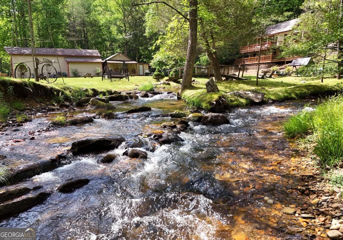 4 bedroom, 2.5 bathroom, 2,016 sq ft cabin,single family residence for sale at 13111 Big Creek Road, Cherry Log, GA 30522 — photo 3