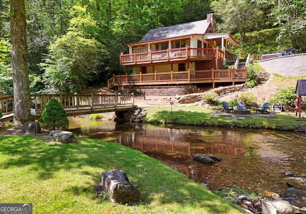 4 bedroom, 2.5 bathroom, 2,016 sq ft cabin,single family residence for sale at 13111 Big Creek Road, Cherry Log, GA 30522 — photo 1 of 54