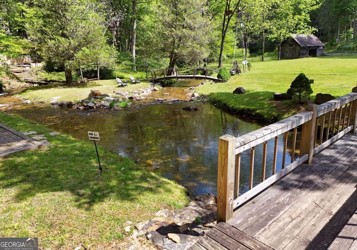 4 bedroom, 2.5 bathroom, 2,016 sq ft cabin,single family residence for sale at 13111 Big Creek Road, Cherry Log, GA 30522 — photo 9