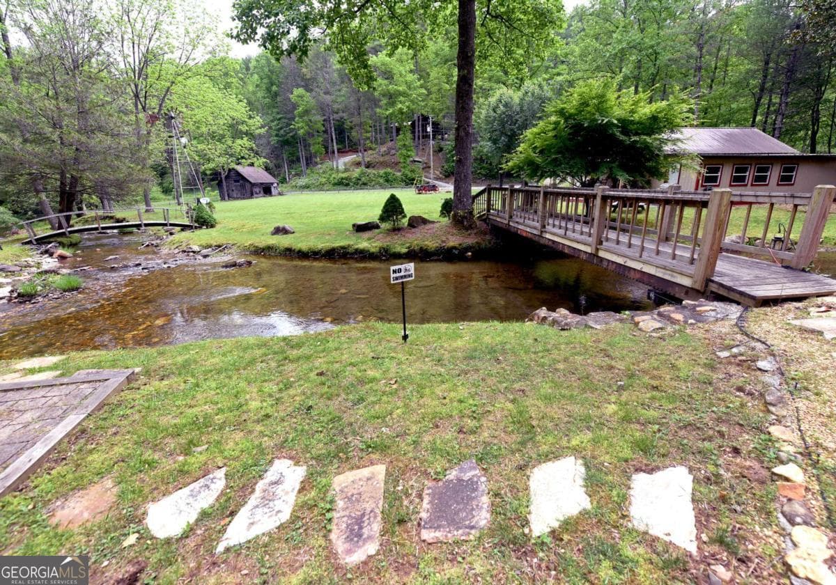 4 bedroom, 2.5 bathroom, 2,016 sq ft cabin,single family residence for sale at 13111 Big Creek Road, Cherry Log, GA 30522 — photo 10