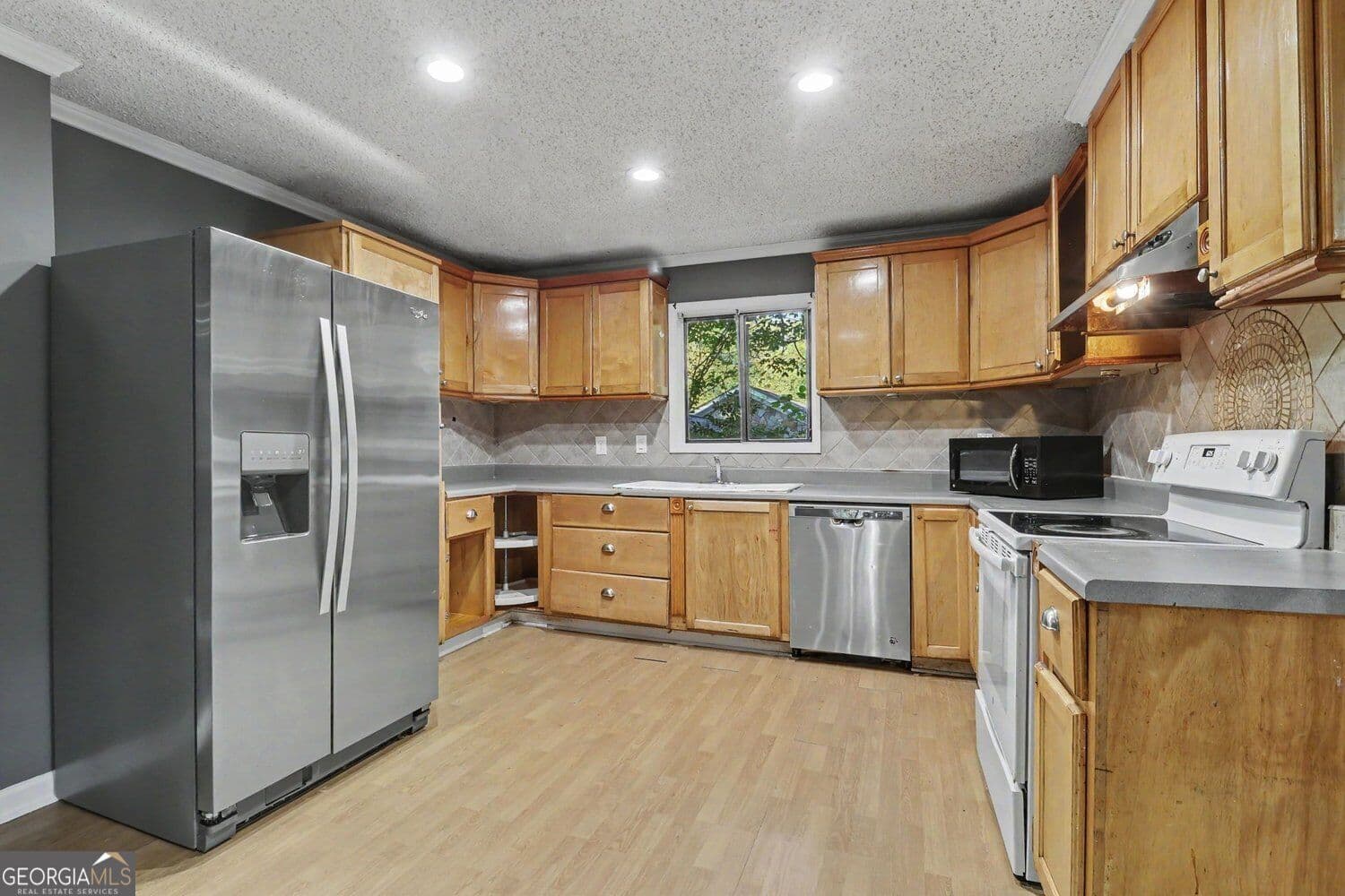 4 bedroom, 2 bathroom, 1,925 sq ft single family residence for sale at 1566 Village Drive, Norcross, GA 30093 — photo 3