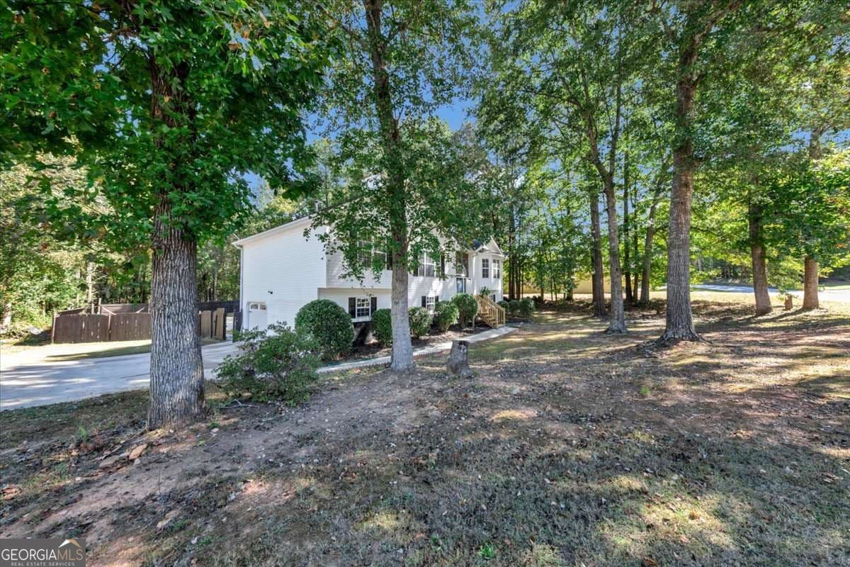 4 bedroom, 3 bathroom, 2,050 sq ft single family residence for sale at 2616 Chesterbrooke Drive, Lithia Springs, GA 30122 — photo 5