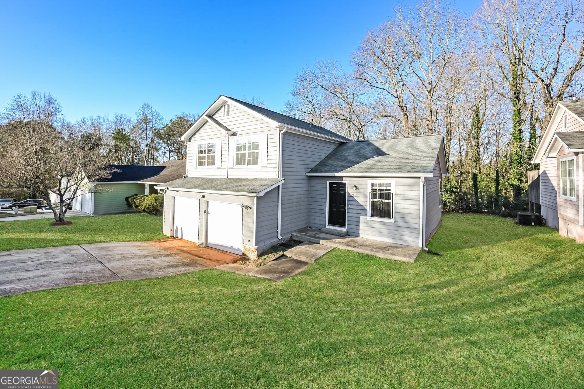 3 bedroom, 2.5 bathroom, 1,400 sq ft single family residence for sale at 1211 To Lani Court, Stone Mountain, GA 30083 — photo 2