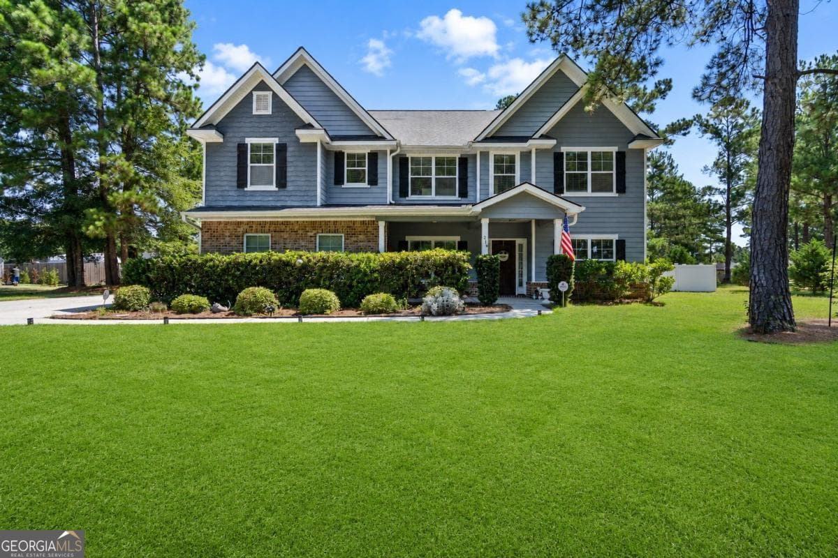 5 bedroom, 4 bathroom, 3,466 sq ft single family residence for sale at 214 Cypress Lakes Drive, Bloomingdale, GA 31302 — photo 1 of 51