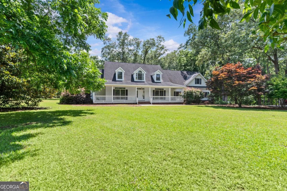 4 bedroom, 3 bathroom, 4,938 sq ft single family residence for sale at 144 Sinclair Circle, Eatonton, GA 31024 — photo 2
