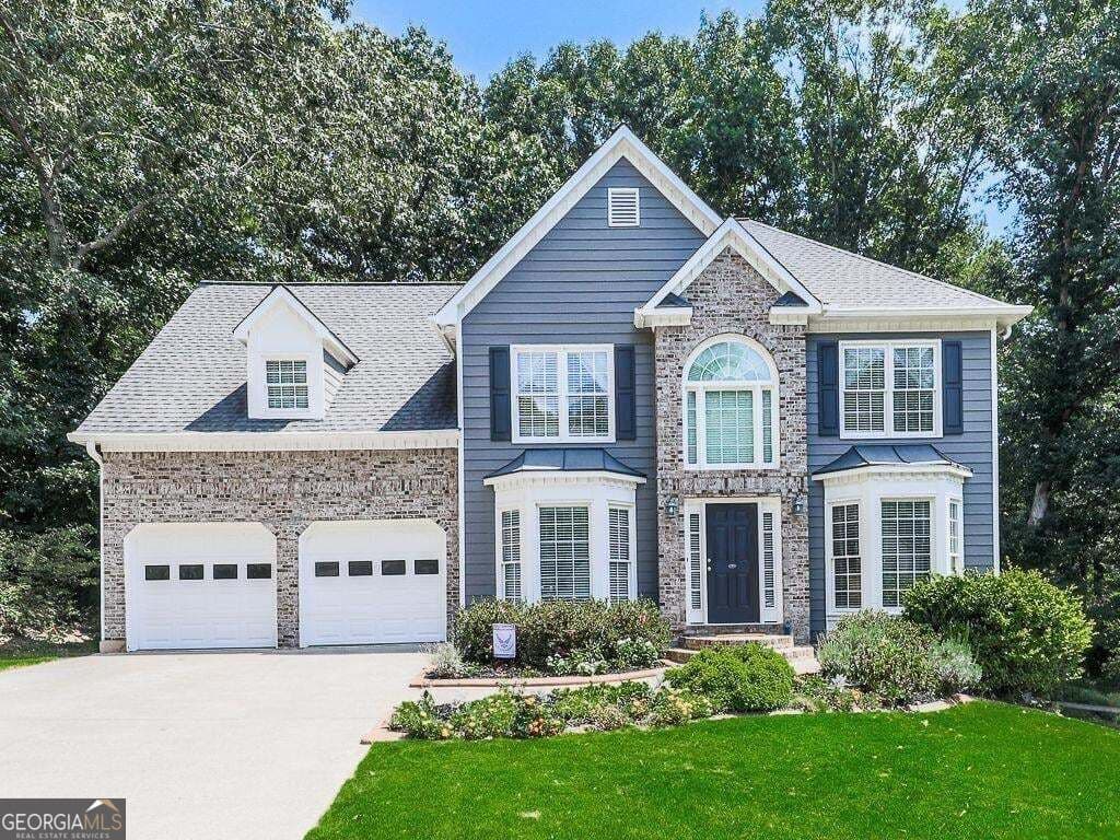 5 bedroom, 4 bathroom, 2,864 sq ft single family residence for sale at 373 Yonah Circle, Woodstock, GA 30189 — photo 1 of 45
