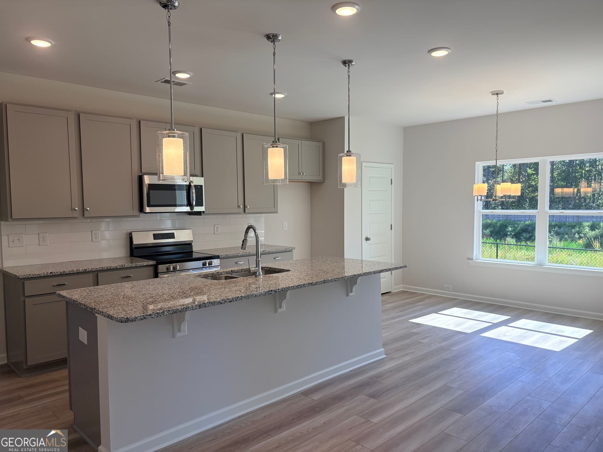 4 bedroom, 2.5 bathroom, 1,933 sq ft single family residence for sale at 1409 Trellis Court LOT 12, Hampton, GA 30228 — photo 3