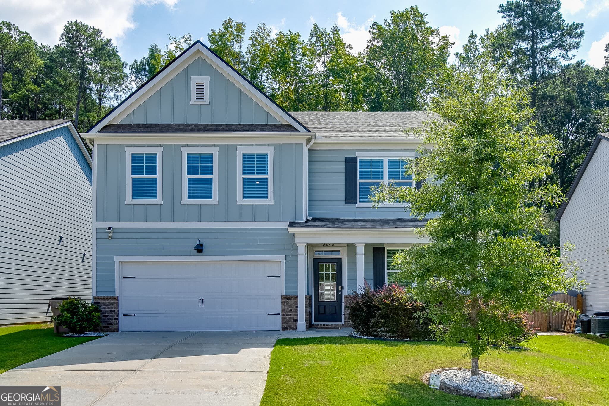 5 bedroom, 3 bathroom, 2,788 sq ft single family residence for sale at 6078 Trumpet Flower Avenue, Flowery Branch, GA 30542 — photo 1 of 53