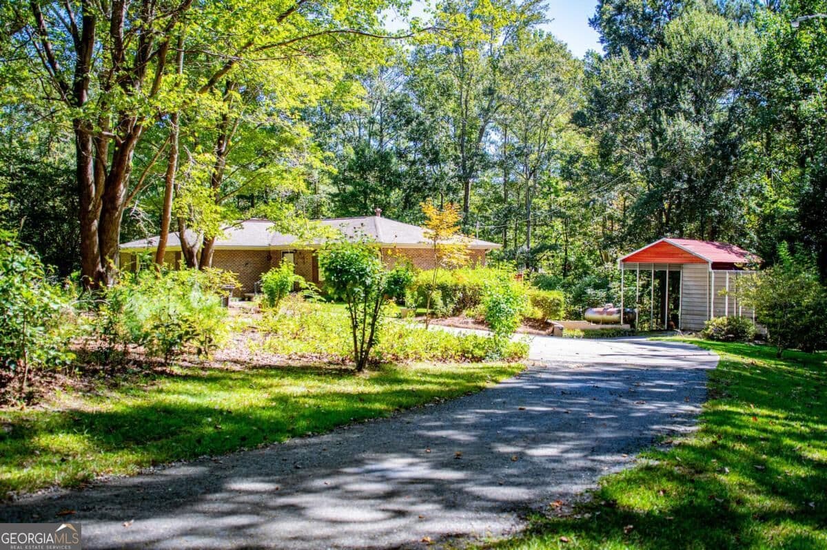 4 bedroom, 3 bathroom, 1,612 sq ft single family residence for sale at 59 Hutcheson Ferry Road, Whitesburg, GA 30185 — photo 2