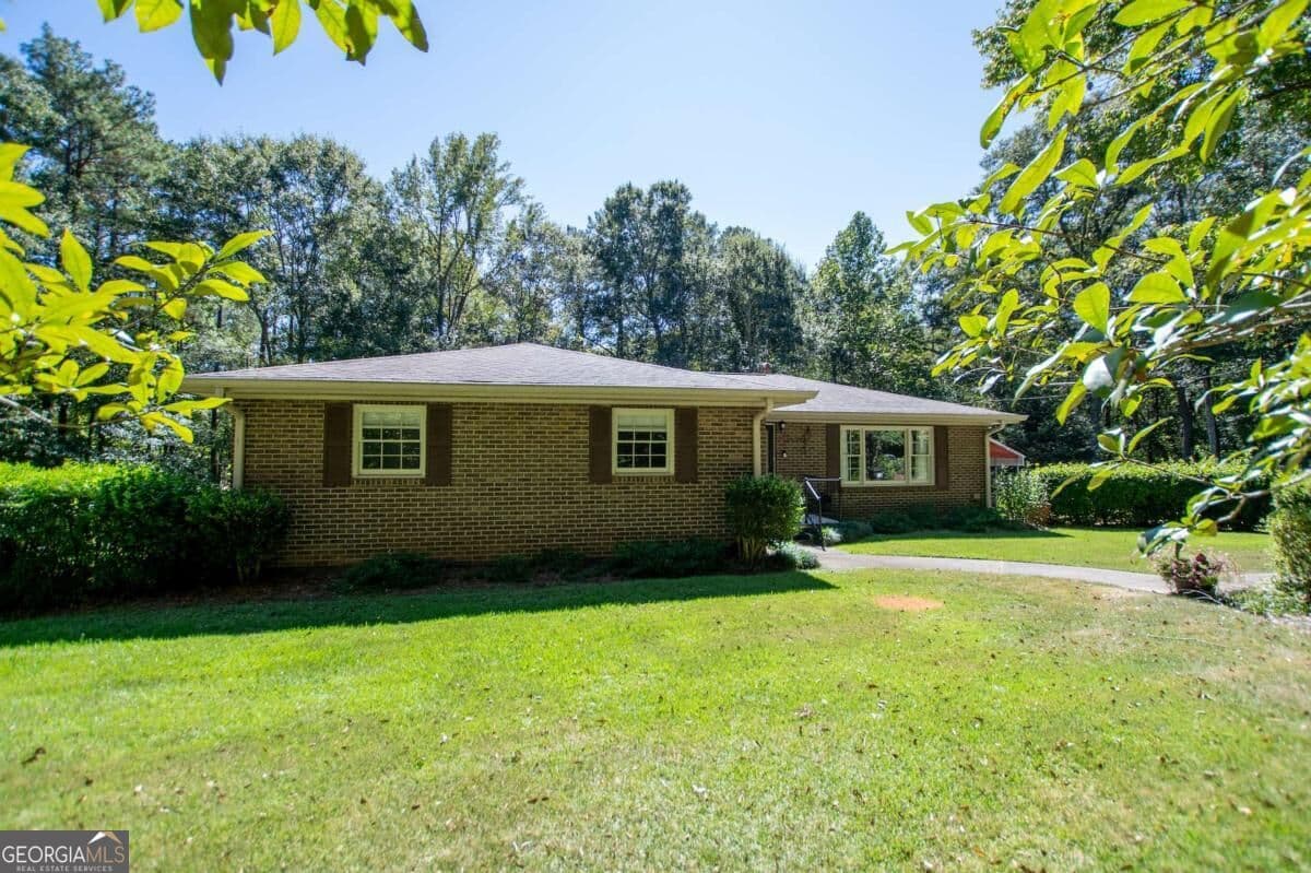 4 bedroom, 3 bathroom, 1,612 sq ft single family residence for sale at 59 Hutcheson Ferry Road, Whitesburg, GA 30185 — photo 3
