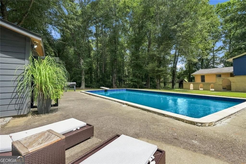 4 bedroom, 3 bathroom, 3,880 sq ft single family residence for sale at 3806 Loganville Highway, Loganville, GA 30052 — photo 2