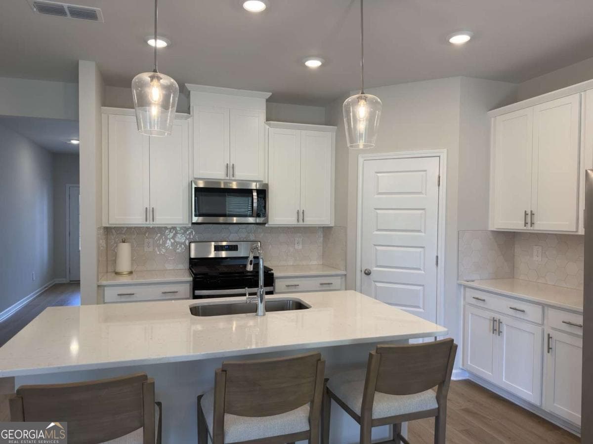 5 bedroom, 3 bathroom single family residence for sale at 2414 Martin Spring Bend, Lawrenceville, GA 30045 — photo 8