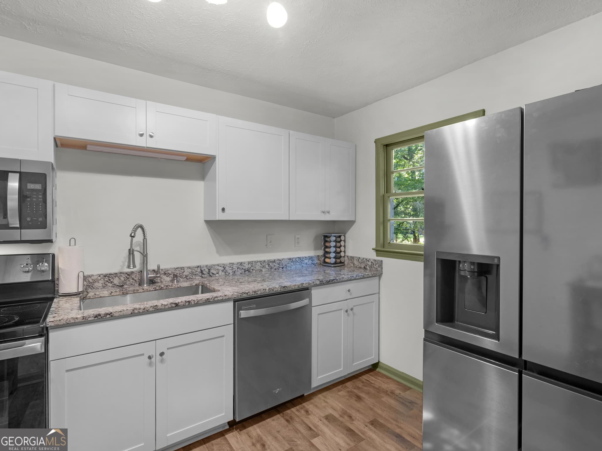 3 bedroom, 1.5 bathroom, 1,075 sq ft single family residence for sale at 3790 Sweetbriar Circle, Lithia Springs, GA 30122 — photo 4