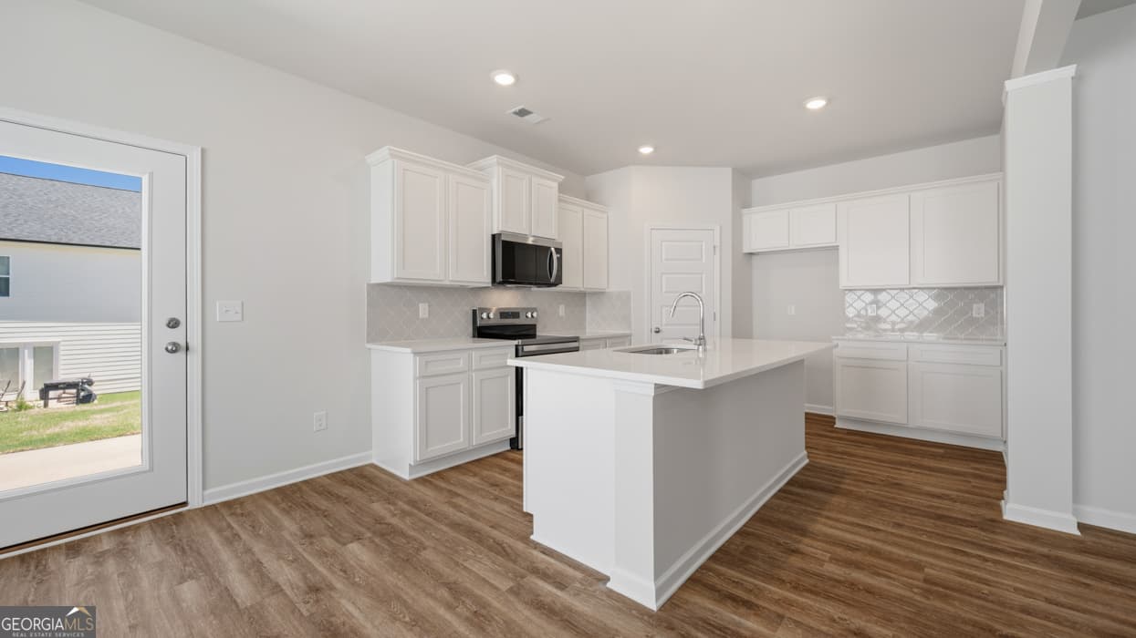 4 bedroom, 2.5 bathroom single family residence for sale at 11979 Aukerman Way, Hampton, GA 30228 — photo 9