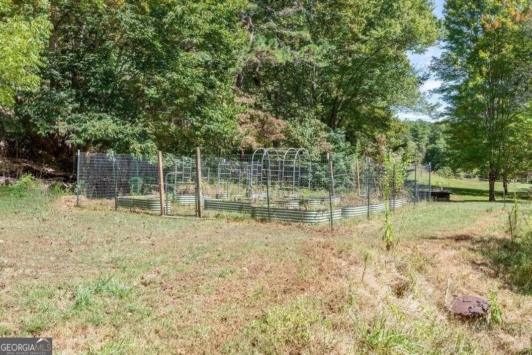 6 bedroom, 4.5 bathroom, 5,286 sq ft single family residence for sale at 1016 Mull Road, Morganton, GA 30560 — photo 5