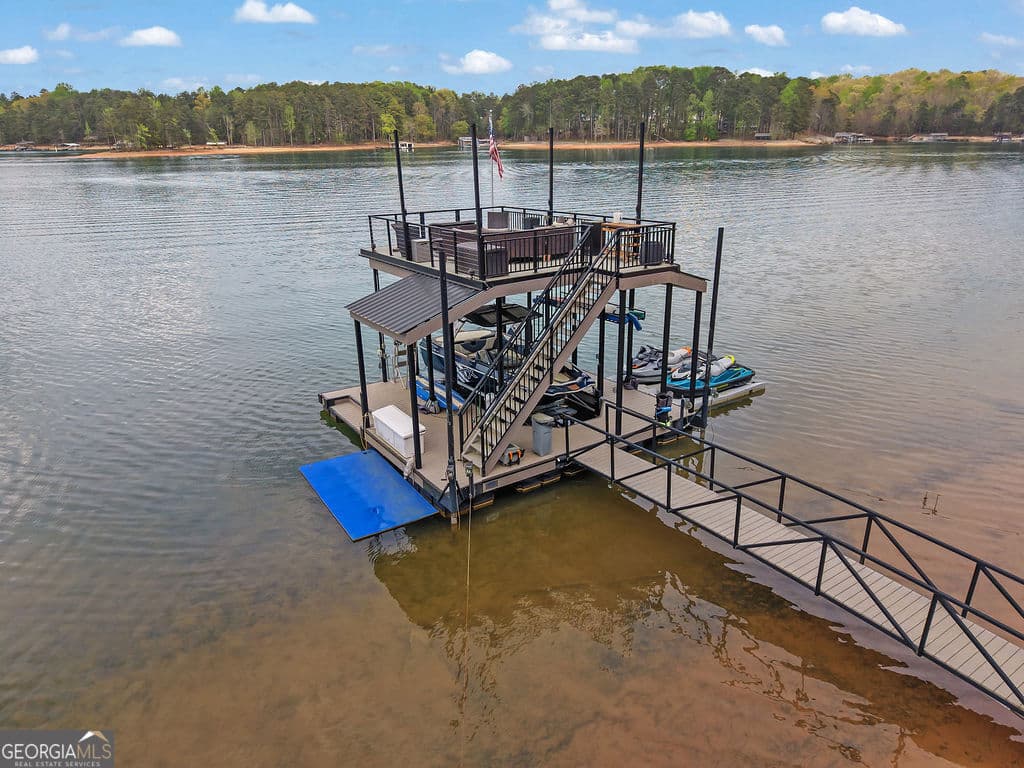 7 bedroom, 6.5 bathroom, 6,434 sq ft single family residence for sale at 6093 Shadburn Ferry Road, Buford, GA 30518 — photo 4