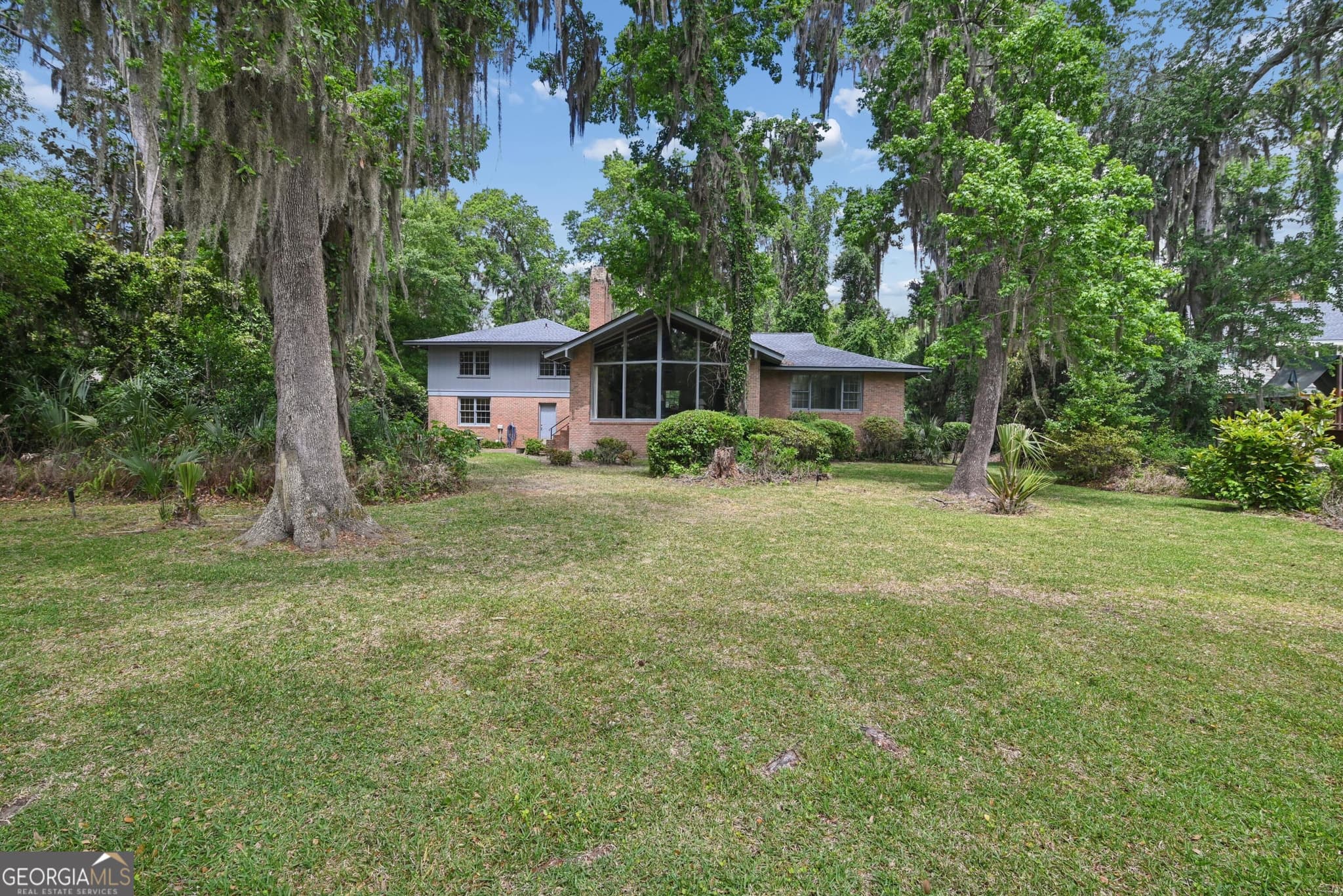 4 bedroom, 2.5 bathroom, 2,991 sq ft single family residence for sale at 180 Saint Clair Drive, St. Simons, GA 31522 — photo 1 of 24