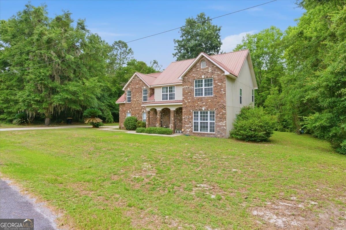 4 bedroom, 2.5 bathroom, 2 sq ft single family residence for sale at 1422 Pelican Lane, Townsend, GA 31331 — photo 2
