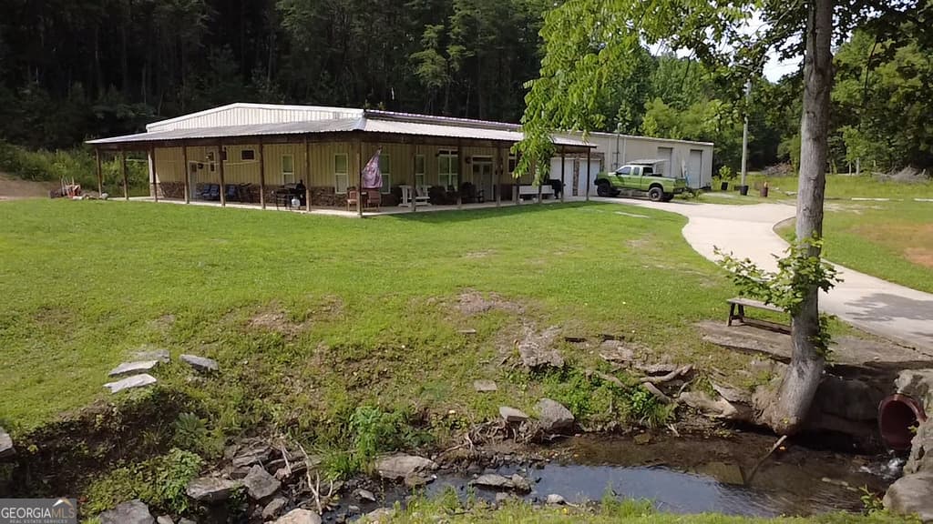 6 bedroom, 4 bathroom, 3,875 sq ft single family residence for sale at 1576 Dripping Springs Road, Lafayette, GA 30728 — photo 4