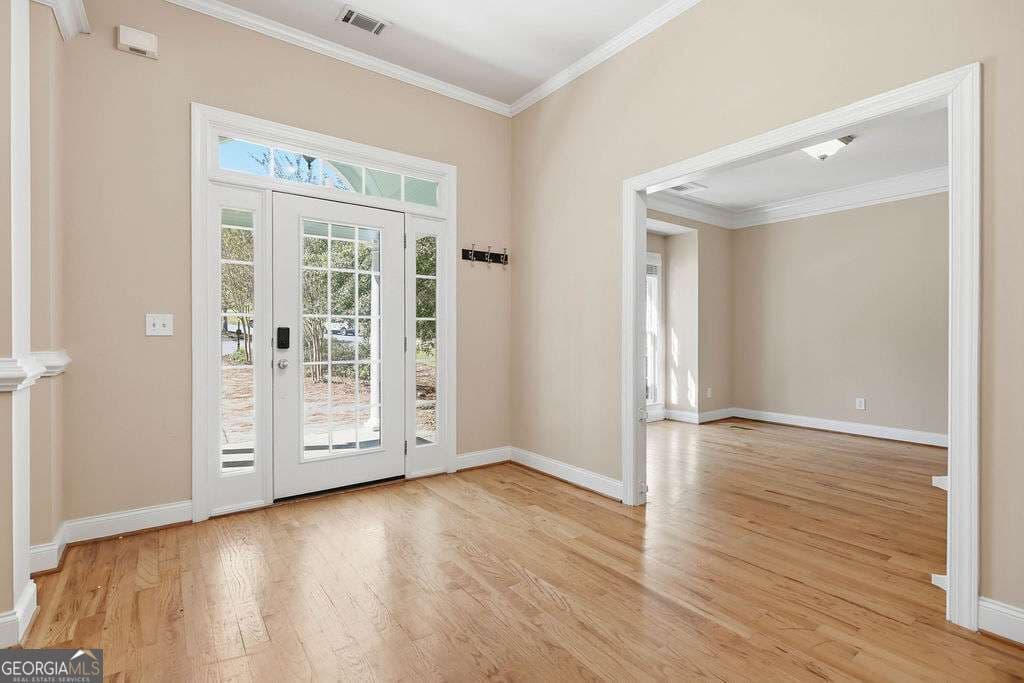 5 bedroom, 4.5 bathroom, 5,131 sq ft single family residence for sale at 1040 Pin Oak Court, Bishop, GA 30621 — photo 2