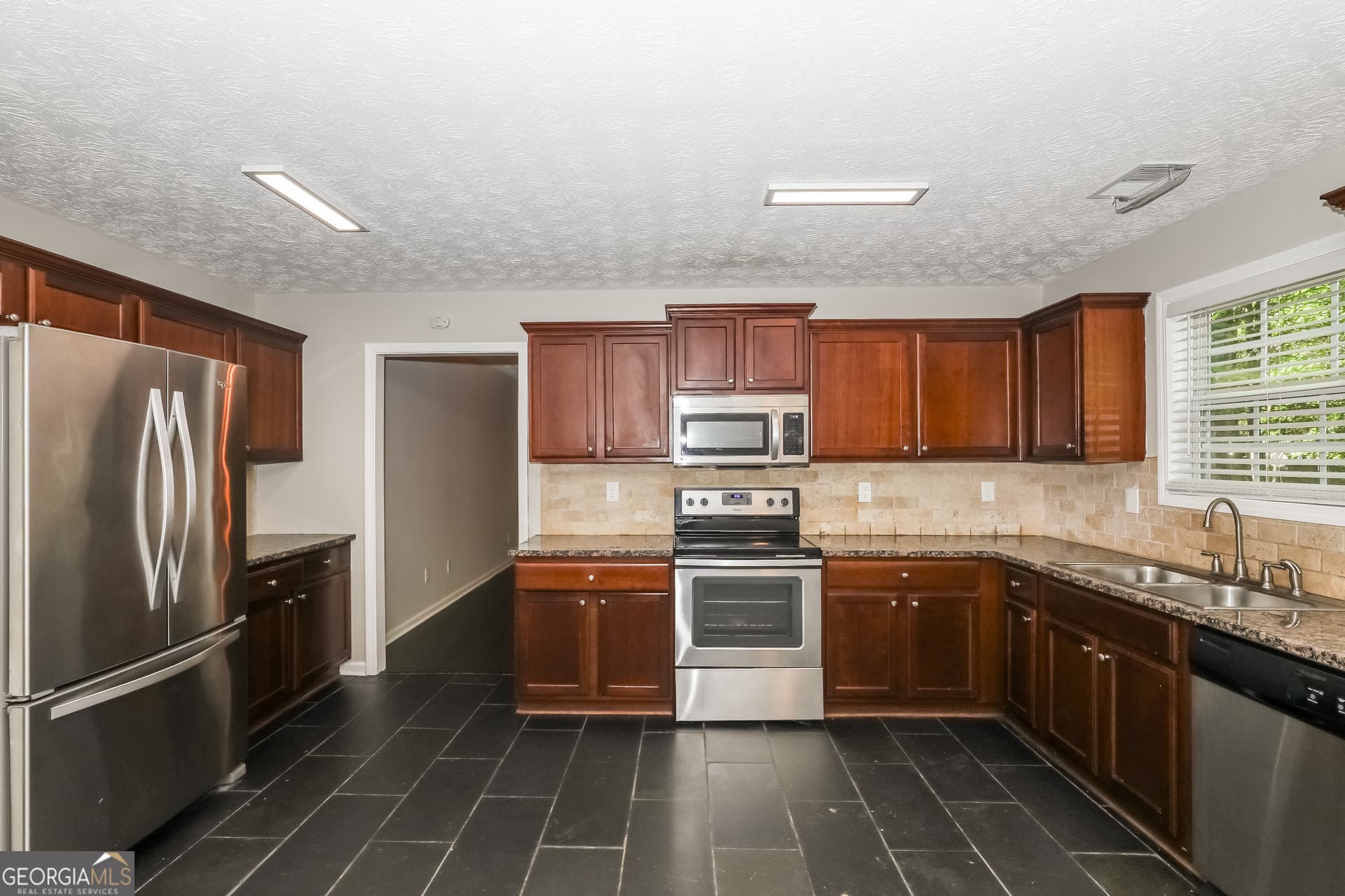 4 bedroom, 2.5 bathroom, 2,932 sq ft single family residence for sale at 7895 Waterwheel Way, Jonesboro, GA 30238 — photo 6