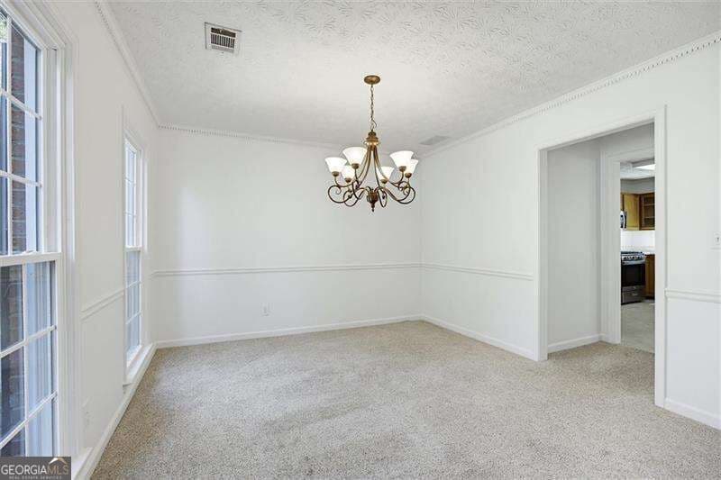 4 bedroom, 2.5 bathroom, 2,152 sq ft single family residence for sale at 5214 Michaels Way, Woodstock, GA 30188 — photo 6