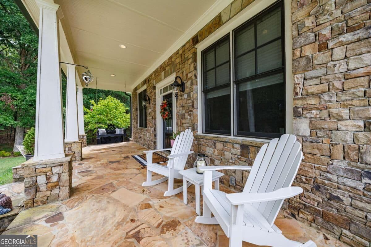 6 bedroom, 4 bathroom, 6,586 sq ft single family residence for sale at 4478 Cedarcrest Road, Acworth, GA 30101 — photo 2