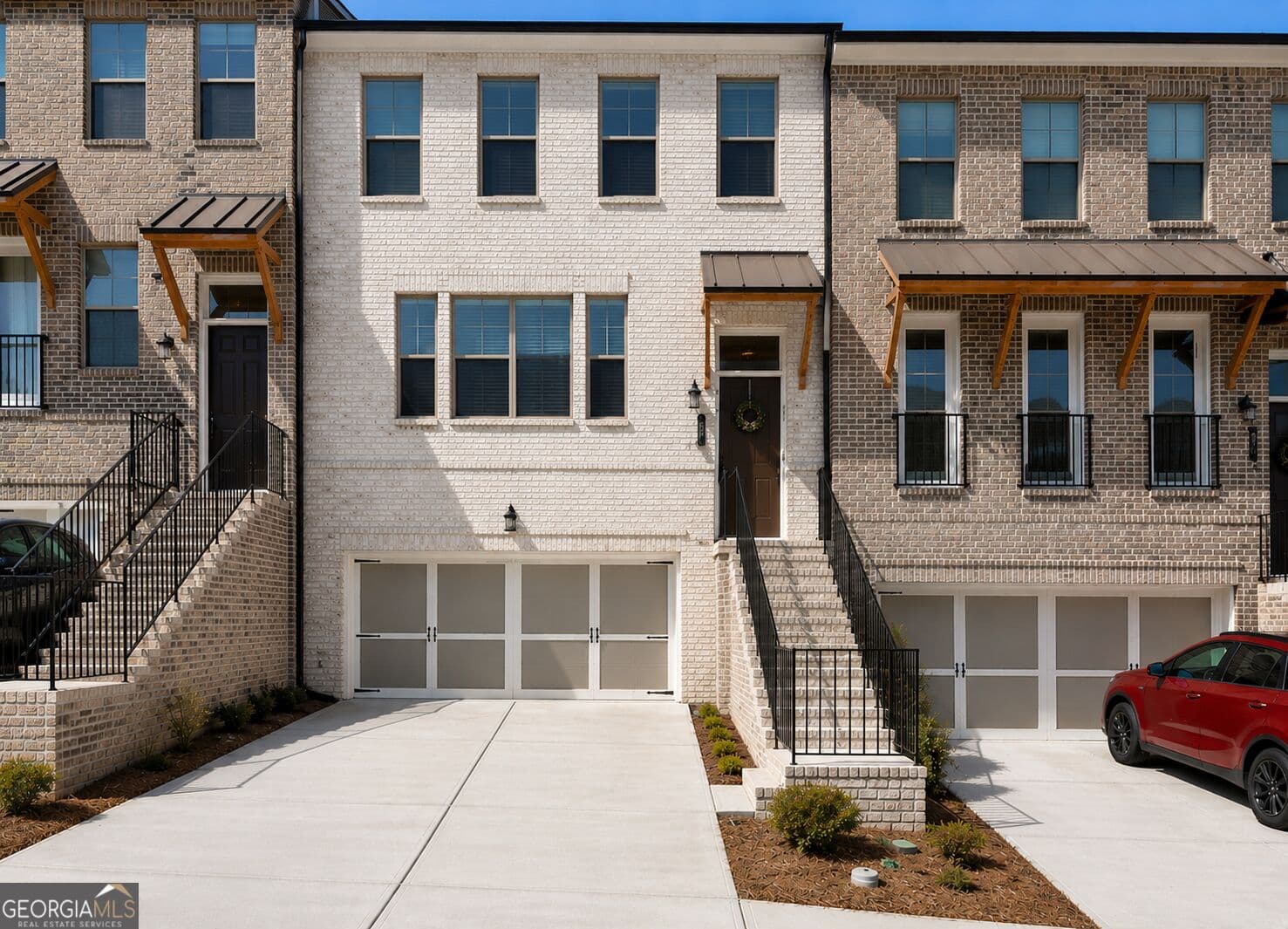 4 bedroom, 3.5 bathroom, 2,589 sq ft townhouse for sale at 2381 Action Way, Snellville, GA 30078 — photo 1 of 7