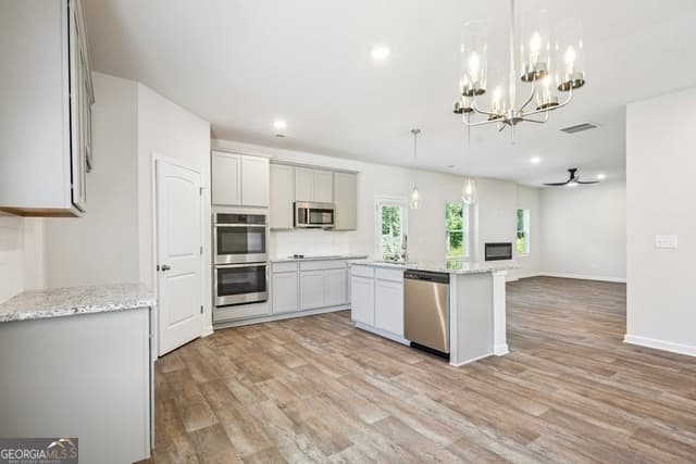 5 bedroom, 3 bathroom, 2,500 sq ft single family residence for sale at 447 River Walk Farm Parkway, Covington, GA 30014 — photo 5