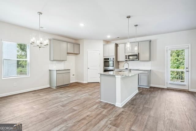 5 bedroom, 3 bathroom, 2,500 sq ft single family residence for sale at 447 River Walk Farm Parkway, Covington, GA 30014 — photo 4