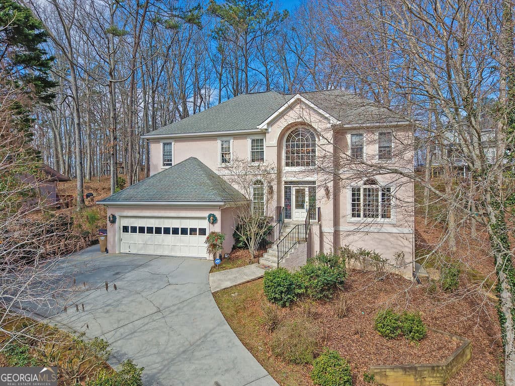 5 bedroom, 3.5 bathroom, 3,450 sq ft single family residence for sale at 1420 Olde Forge Lane, Woodstock, GA 30189 — photo 2