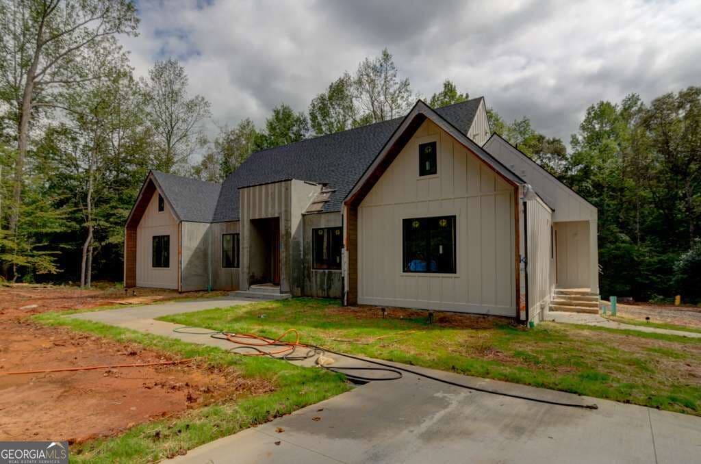 4 bedroom, 3.5 bathroom single family residence for sale at 7405 Nicholson Road, Cumming, GA 30028 — photo 2