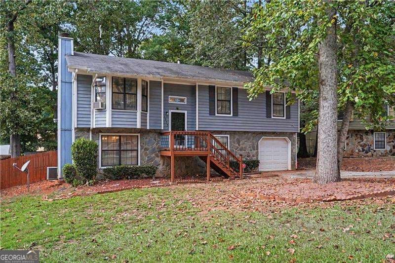 4 bedroom, 2.5 bathroom, 2,141 sq ft single family residence for sale at 1955 Woodlot Trail, Lithonia, GA 30058 — photo 1 of 25