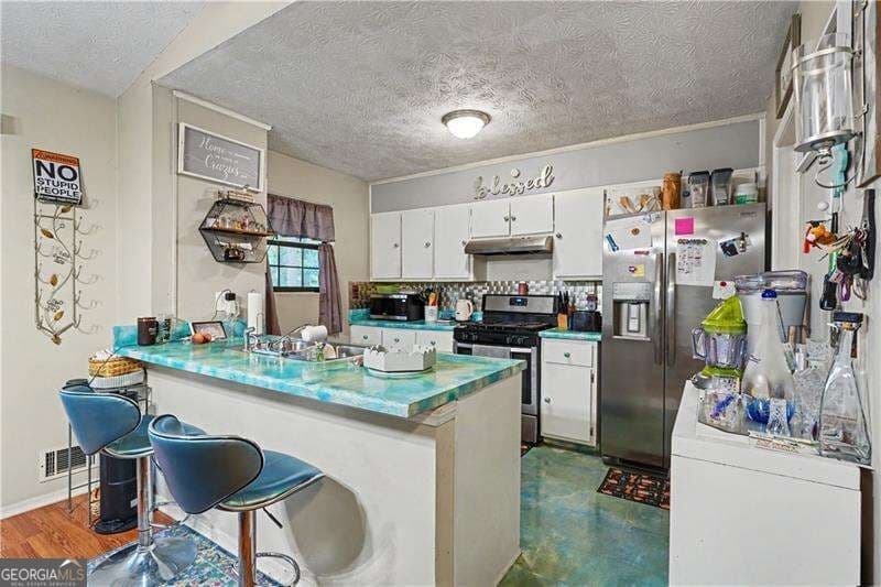 4 bedroom, 2.5 bathroom, 2,141 sq ft single family residence for sale at 1955 Woodlot Trail, Lithonia, GA 30058 — photo 9